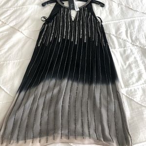 Parker black hand-beaded formal dress.